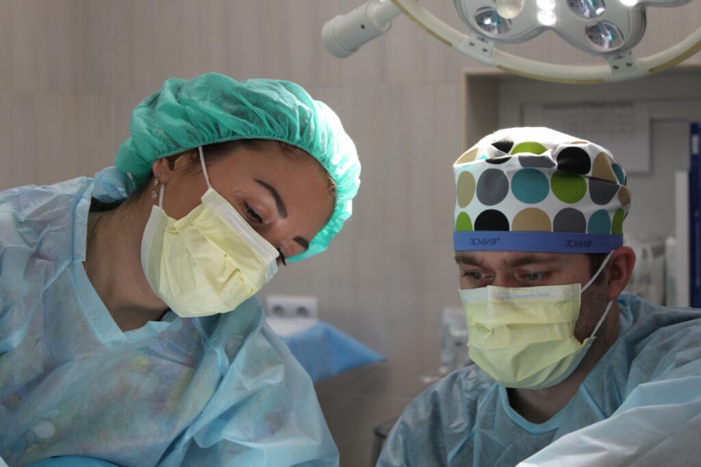 Two doctors performing a procedure