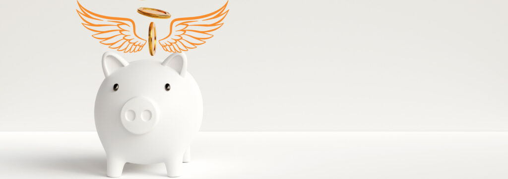 piggy bank with coins dropping in, angel wings on either side of coin
